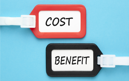 Red Luggage tag with Cost written on the paper. A black luggage tag with the word benefit written on the paper.