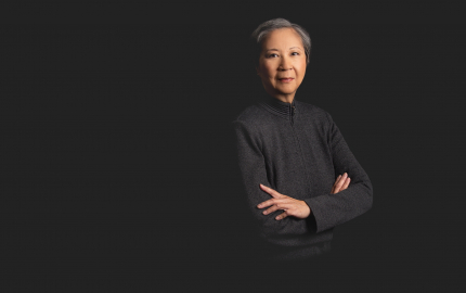 Marian C. Hwang is wearing a dark dress.