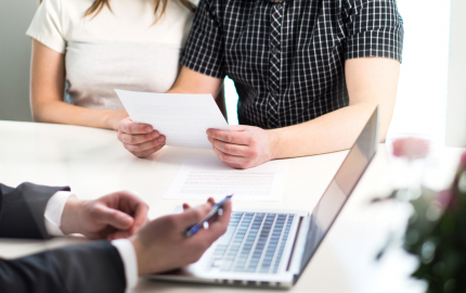 Woman, man and lawyer preparing prenupitial agreement in office.