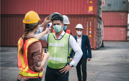 Shipping Worker Having Fever Body Scan by Thermometer