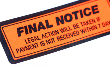Orange sticker with black writing that says FINAL NOTICE Legal action will be taken if payment is not received within 7 days