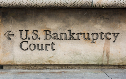 U. S. Bankruptcy Court with an arrow pointing to the left etched into a building.