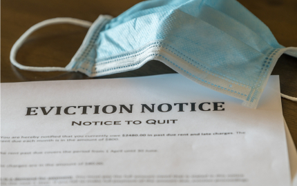 Eviction Notice with a medical face mask above the paper.