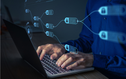 Person on a laptop with a financial blockchain floating in front of the screen.