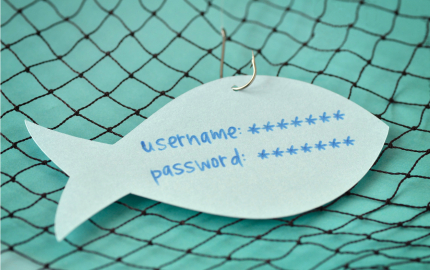 Username and password written on a paper note in the shape of a fish attached to a hook