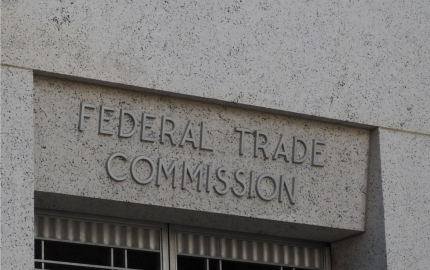 Up close view of the Federal Trade Commission sign on the building.